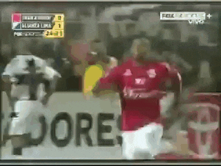 a soccer game is being played in front of a banner that says " dore "