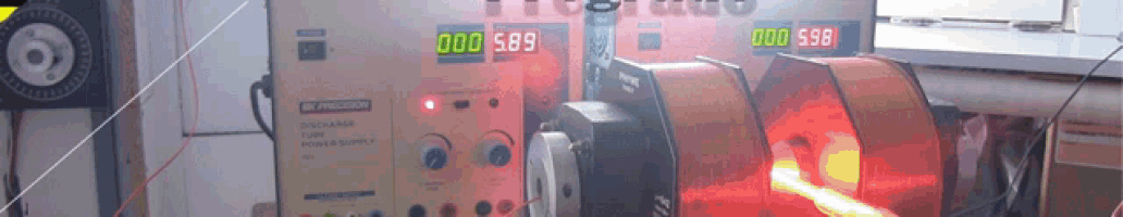 a precision power supply is being used in a laboratory with a red light behind it