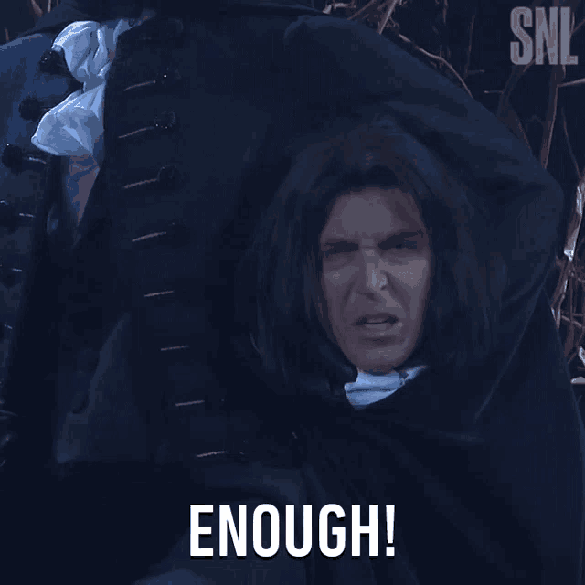 a man in a cape says " enough " in white letters