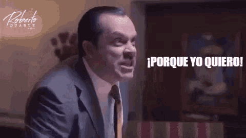 a man in a suit and tie is screaming with the words porque yo quiero written below him
