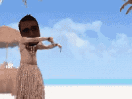 a man in a hawaiian outfit is dancing on the beach