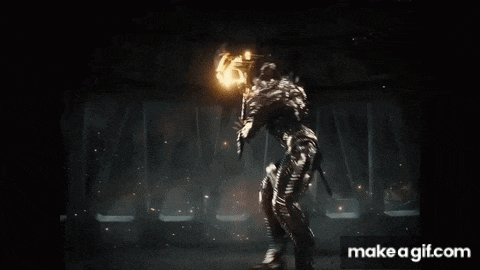a superhero is flying through the air in a dark room with a lot of smoke coming out of it .