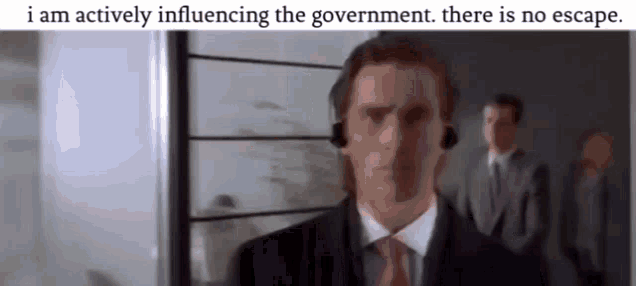 a man in a suit and tie is wearing a headset with the words i am actively influencing the government