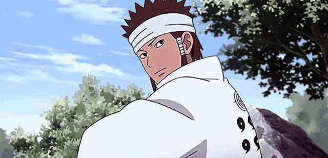 a man with a bandage on his head is wearing a white shirt