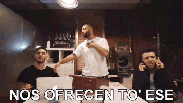a group of men sitting around a table with nos ofrecen to ese written in the corner