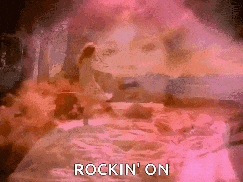 a woman is dancing in a room with a pink background and the words `` rockin ' on '' .