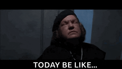 a woman in a black hat is standing in front of a wall and says `` today be like ... ''