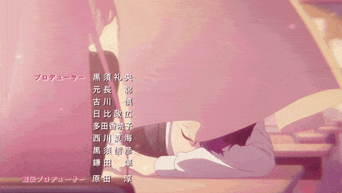 a girl laying on a desk with a list of names in chinese