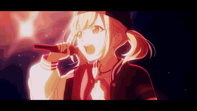 a girl is singing into a microphone with a red light behind her