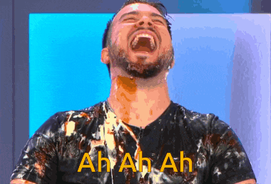 a man in a black shirt is covered in liquid and the words ah ah ah are written above him