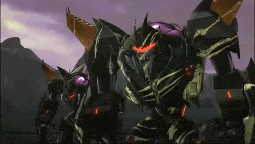 a group of transformers are standing in a field