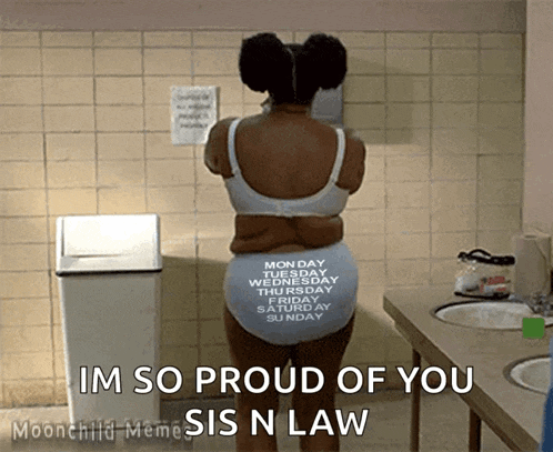 a woman standing in a bathroom with the words im so proud of you sis n law