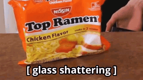 a bag of nissin top ramen chicken flavor is on a table