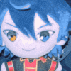 a stuffed animal with blue hair and yellow eyes is sitting on a bed .