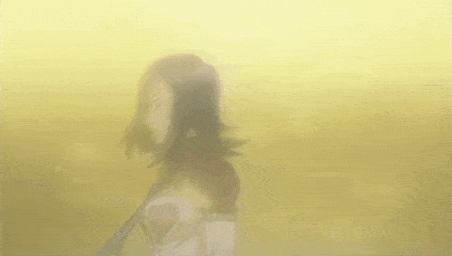 a girl with a heart on her shirt is standing in front of a yellow background