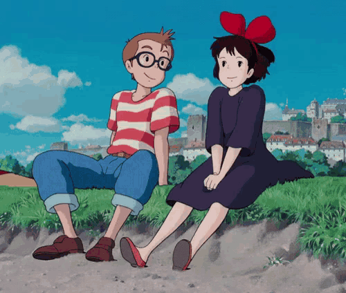 a boy and a girl are sitting on a grassy hill