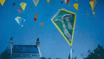 a bunch of kites are flying in the sky