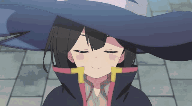 a girl with her eyes closed wearing a hat and a coat
