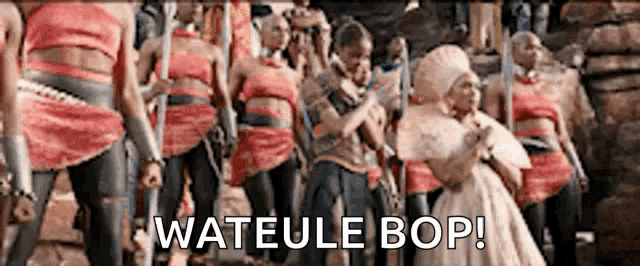 a group of people are standing next to each other with the words wateule bop written on the bottom .