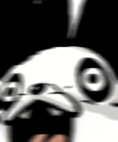 a blurry picture of a rabbit 's face with a black background .
