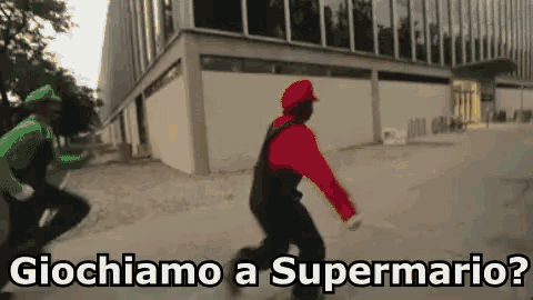 two people dressed as mario and luigi are running down a street .