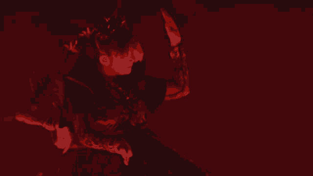 a person 's face is visible in the dark