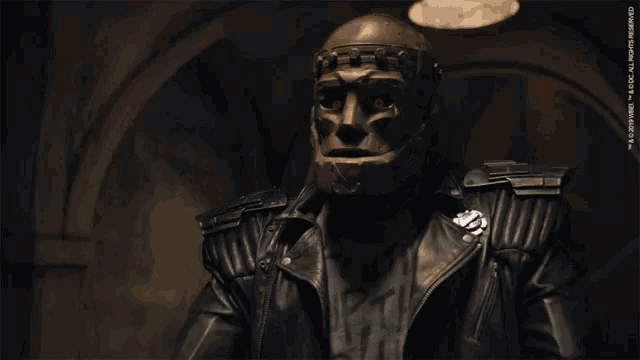 a man in a mask is pointing at the camera with the words " f @ % * & you " written below him