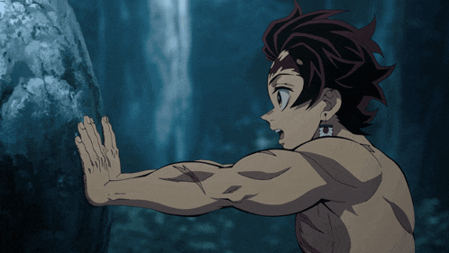 a man without a shirt is leaning against a rock with his hand