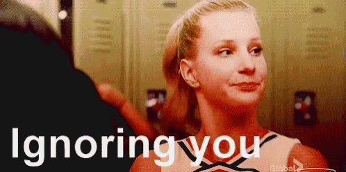 a cheerleader is standing in front of lockers with the words ignoring you written on the bottom