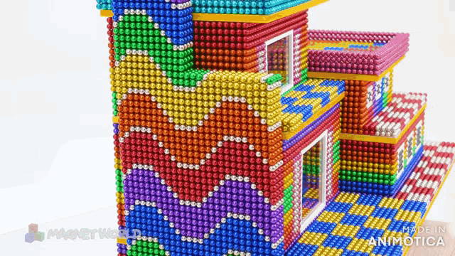 a building made out of magnets with the words made in animatica on the bottom right