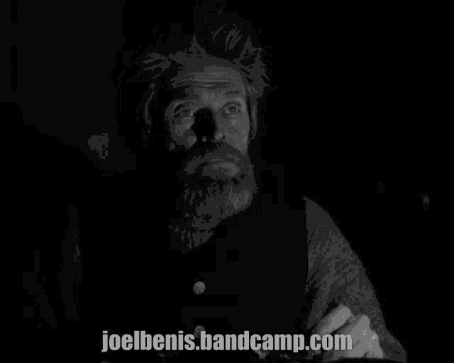 a black and white photo of a man with the website joelbenis.bandcamp.com visible