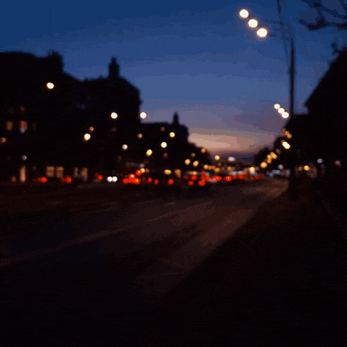 a blurred image of a street with the words " never surrender "