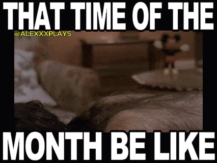 a picture of a man laying on a bed with a caption that says " that time of the month be like "