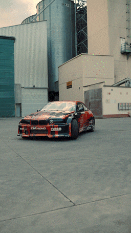 a red and black car with the word turbo on it