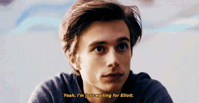 a young man says yeah i 'm just waiting for elliott in a close up of his face