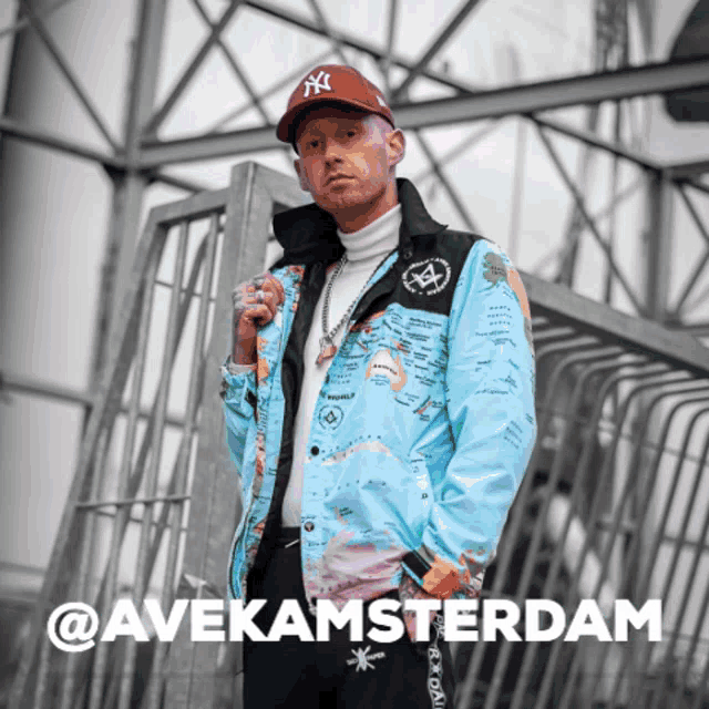 a man wearing a jacket with a map on it and a hat with the letter ny on it