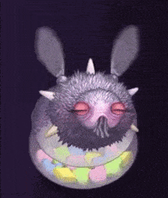 a cartoon character is sitting inside of a bowl of candy .