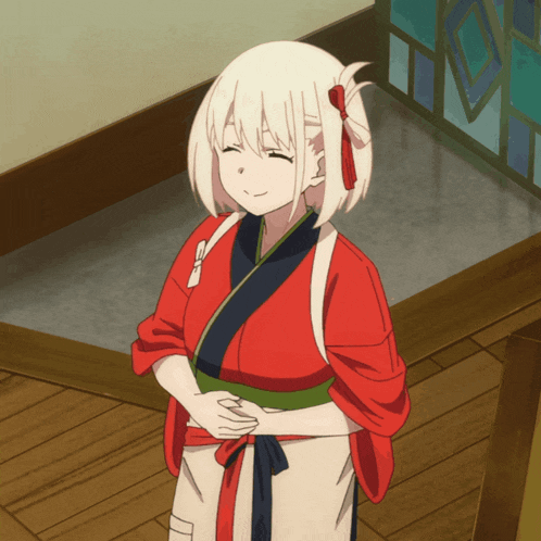 a girl with white hair is wearing a red robe