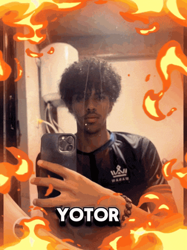 a man taking a picture of himself with yotor written in the corner