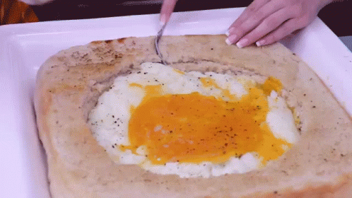 Giant Bread Massive Egg In A Hole GIF - Giant Bread Massive Egg In A Hole Egg GIFs