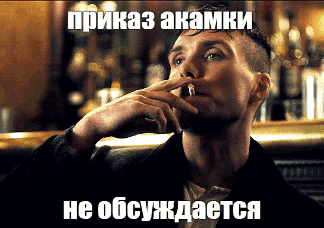 a man smoking a cigarette with a foreign language caption
