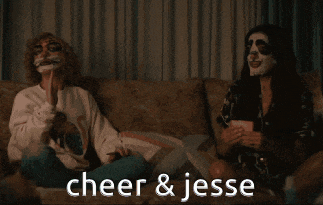 two women sitting on a couch with their faces painted and the words cheer and jesse written on the bottom