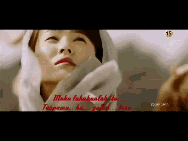 a woman with a scarf around her head has the number 15 on the bottom right