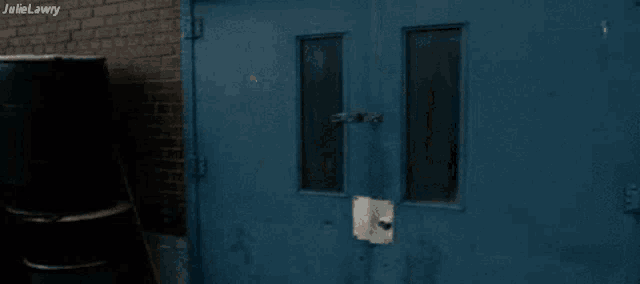 a blue door with the word julie lawry on the bottom