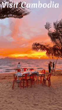 a poster for cambodia shows a sunset and a table and chairs on the beach
