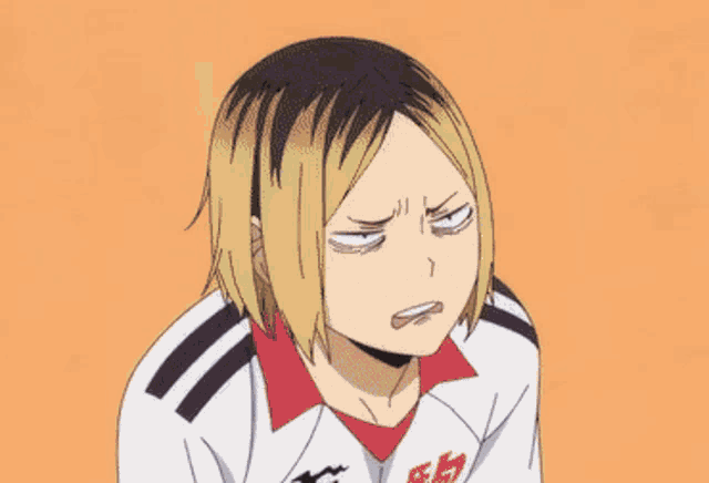 a close up of a person making a funny face while wearing a white shirt .