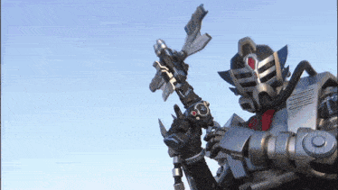 a robot is holding a sword with the letter s on the bottom