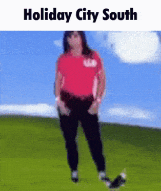 a woman in a red shirt is standing in a field with the words holiday city south written above her