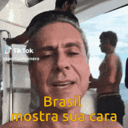 a shirtless man says brasil mostra sua cara in a tiktok video