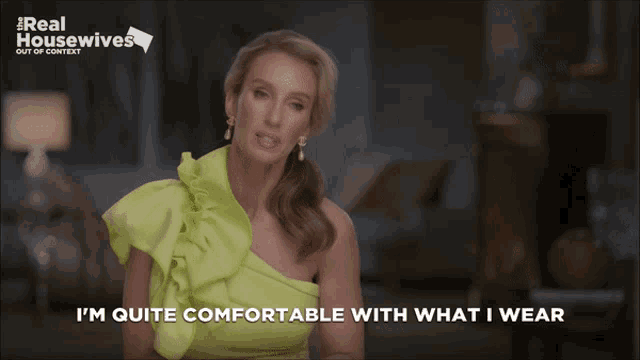 a woman in a green dress says " i m quite comfortable with what i wear "